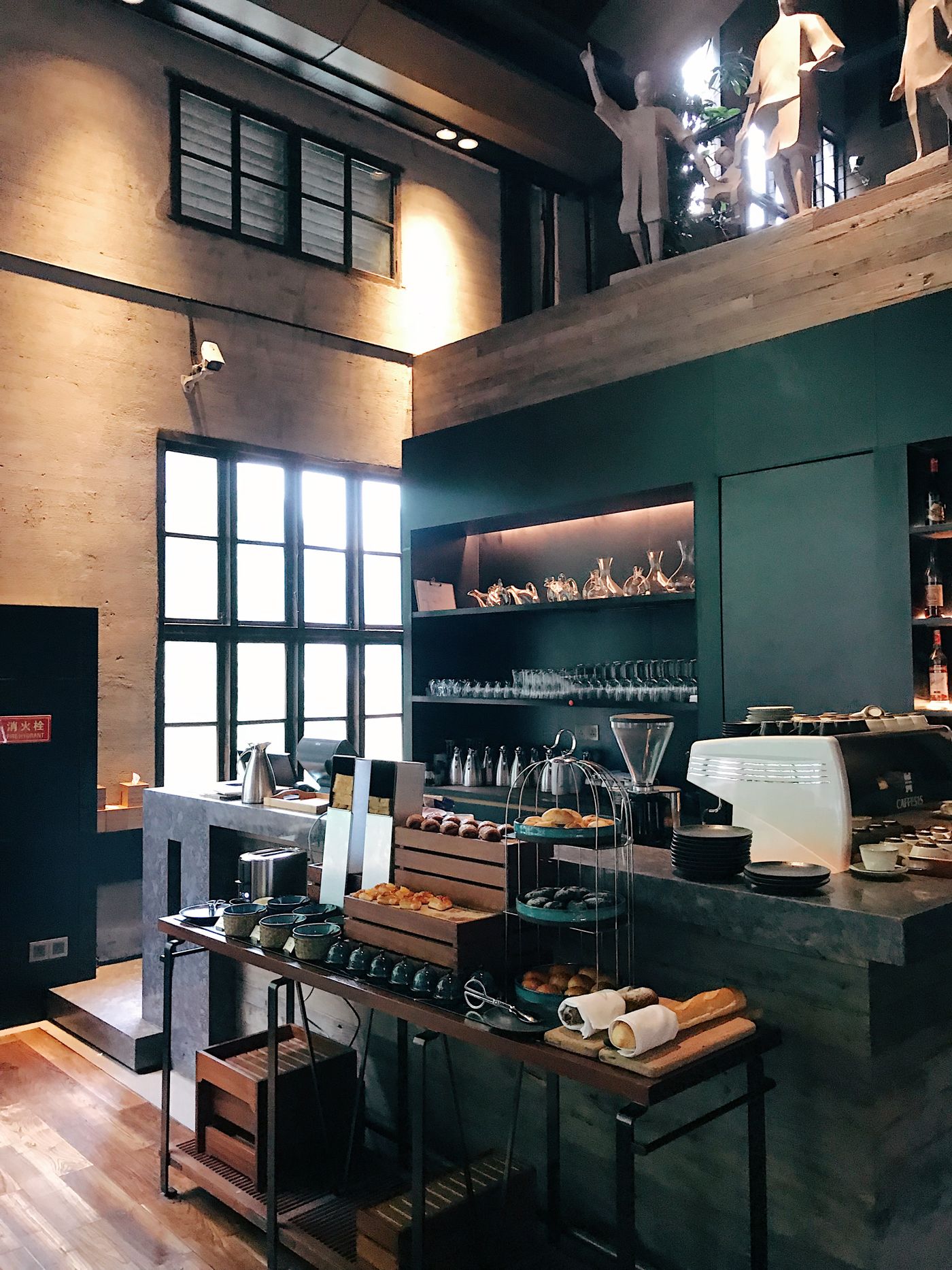 Warm café and lounge interior with timber finishes and a counter